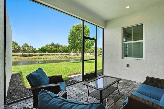 8951 Saint Lucia Dr, Naples, FL 34114 - sunroom / solarium featuring a water view