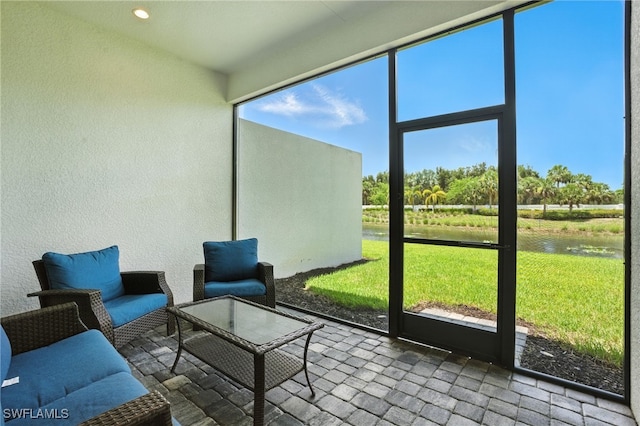 8951 Saint Lucia Dr, Naples, FL 34114 - sunroom featuring a water view and healthy amount of natural light