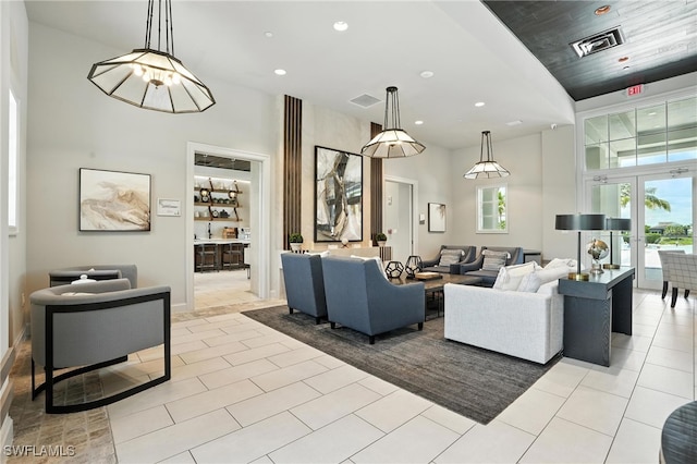 8951 Saint Lucia Dr, Naples, FL 34114 - community lobby with a towering ceiling and recessed lighting