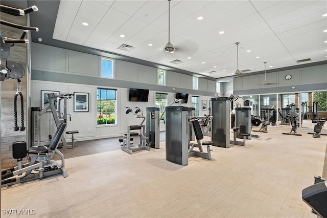 8951 Saint Lucia Dr, Naples, FL 34114 - exercise room featuring carpet floors, a high ceiling, and recessed lighting