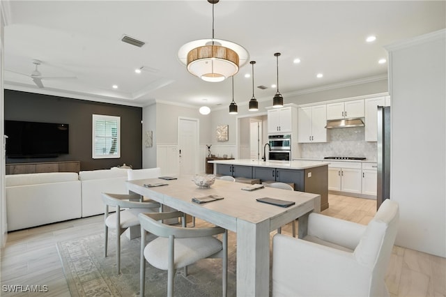 8951 Saint Lucia Dr, Naples, FL 34114 - dining space with crown molding, recessed lighting, and a ceiling fan