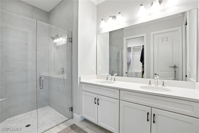 8951 Saint Lucia Dr, Naples, FL 34114 - full bath featuring double vanity, a stall shower, a spacious closet, and tile patterned floors