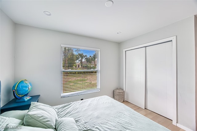 675 Logan Blvd S, Naples, FL 34119 - bedroom with light wood-style floors, a closet, and recessed lighting