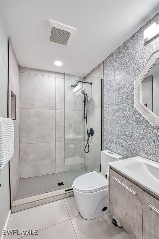 675 Logan Blvd S, Naples, FL 34119 - full bathroom with tiled shower, vanity, and tile patterned floors