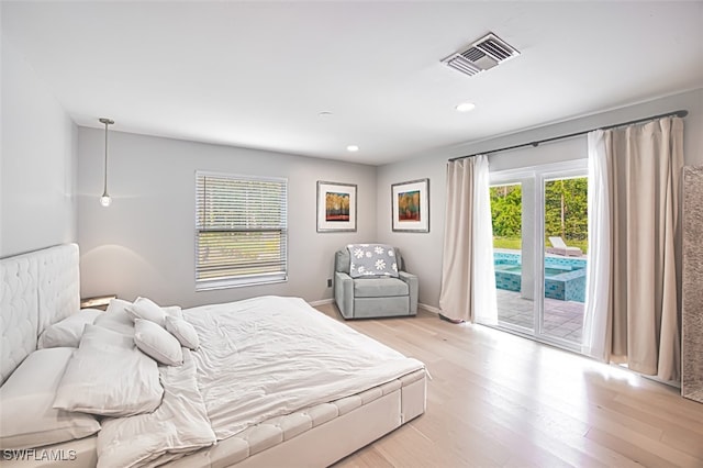 675 Logan Blvd S, Naples, FL 34119 - bedroom featuring access to exterior, light wood-style floors, and recessed lighting