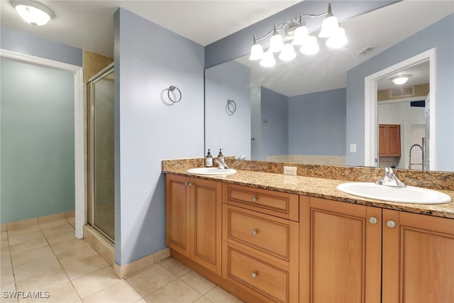 20310 Estero Gardens Cir Unit 203, Estero, FL 33928 - bathroom with double vanity, a shower stall, and tile patterned flooring