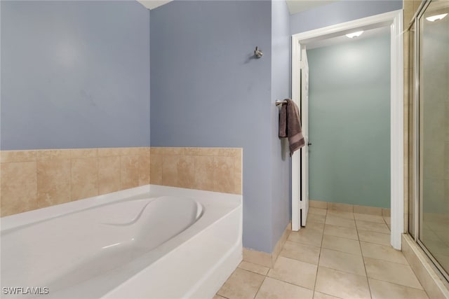 20310 Estero Gardens Cir Unit 203, Estero, FL 33928 - bathroom featuring a shower stall, a garden tub, and tile patterned flooring