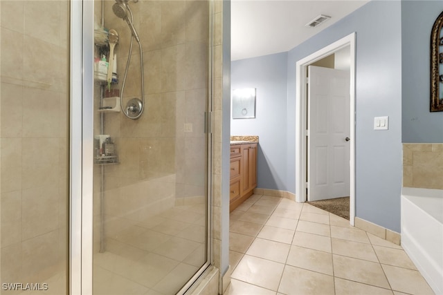 20310 Estero Gardens Cir Unit 203, Estero, FL 33928 - full bath featuring a stall shower, tile patterned flooring, a garden tub, and vanity