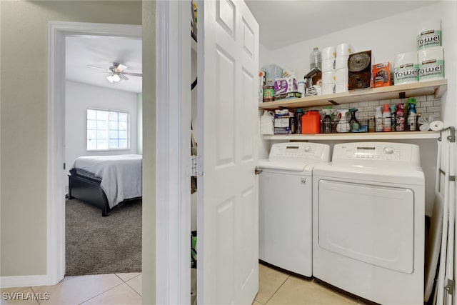 20310 Estero Gardens Cir Unit 203, Estero, FL 33928 - laundry room with washing machine and clothes dryer, ceiling fan, light tile patterned floors, and light colored carpet
