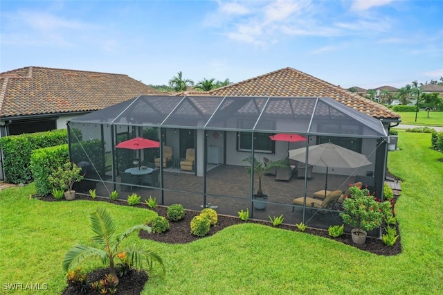19280 Elston Way, Estero, FL 33928 - rear view of property with a tiled roof, a patio, a yard, and a lanai