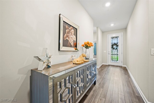 19280 Elston Way, Estero, FL 33928 - hallway featuring dark wood-style floors and recessed lighting