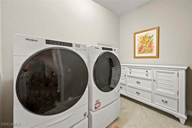 19280 Elston Way, Estero, FL 33928 - laundry room with washer and clothes dryer and light tile patterned floors