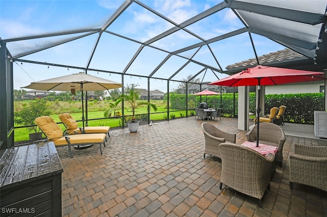 19280 Elston Way, Estero, FL 33928 - view of patio with outdoor dining area and glass enclosure