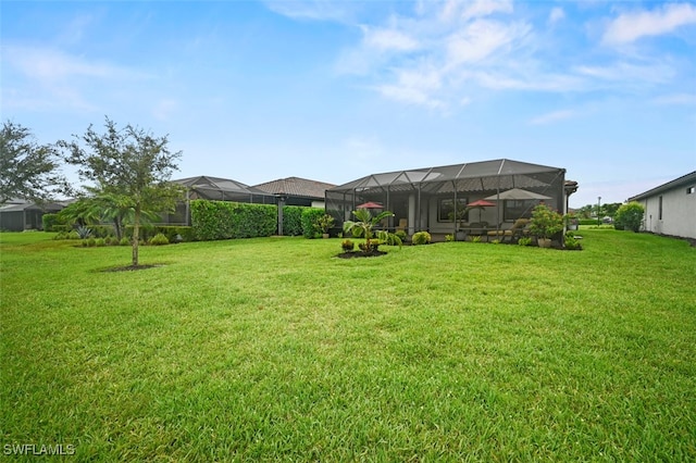 19280 Elston Way, Estero, FL 33928 - view of grassy yard featuring a lanai