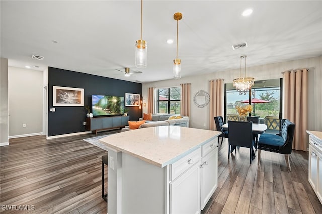 19280 Elston Way, Estero, FL 33928 - kitchen featuring wood finished floors, white cabinetry, a kitchen island, recessed lighting, and a ceiling fan