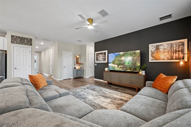 19280 Elston Way, Estero, FL 33928 - living room with wood finished floors, ceiling fan, recessed lighting, and an accent wall