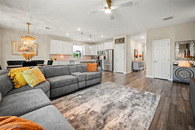 19280 Elston Way, Estero, FL 33928 - living room featuring a chandelier, dark wood-style flooring, a ceiling fan, and recessed lighting