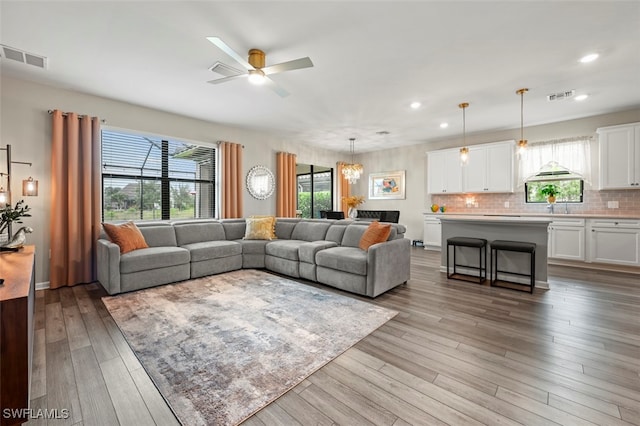 19280 Elston Way, Estero, FL 33928 - living area with healthy amount of natural light, recessed lighting, light wood-style floors, and ceiling fan