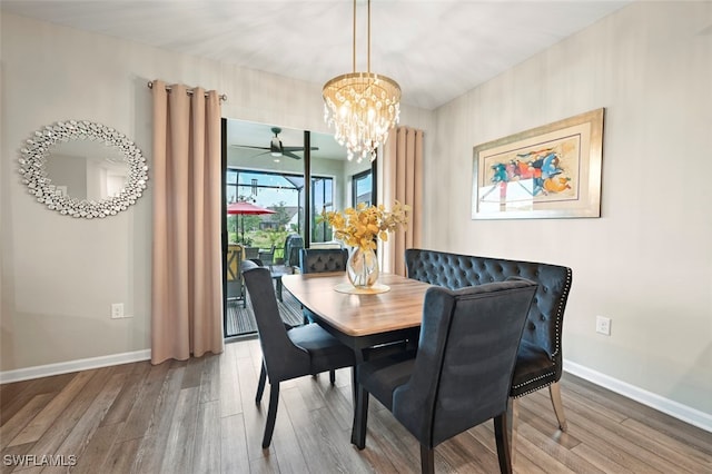 19280 Elston Way, Estero, FL 33928 - dining space featuring wood finished floors, a chandelier, and ceiling fan