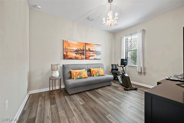 19280 Elston Way, Estero, FL 33928 - living area with a chandelier and wood finished floors