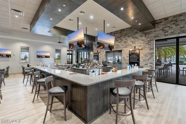 19280 Elston Way, Estero, FL 33928 - kitchen featuring light wood-style flooring, a large island, healthy amount of natural light, and recessed lighting