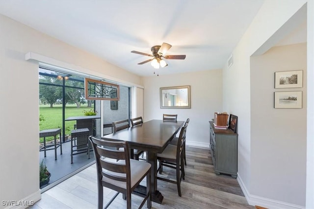 402 Bristle Cone Ln Unit 2, Naples, FL 34113 - dining room featuring ceiling fan and light wood-style floors