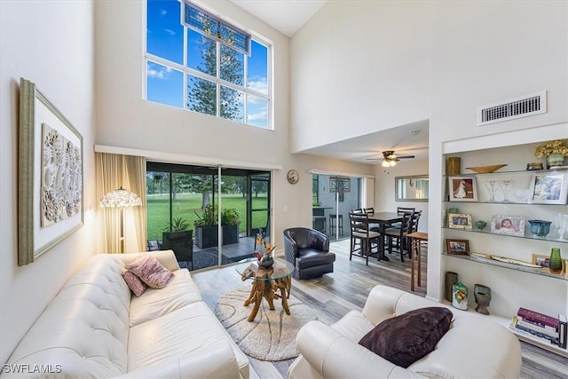 402 Bristle Cone Ln Unit 2, Naples, FL 34113 - living room with a high ceiling, wood finished floors, and ceiling fan