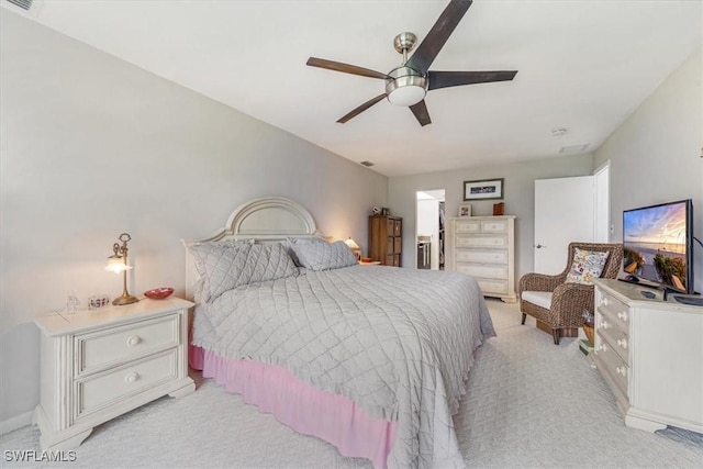402 Bristle Cone Ln Unit 2, Naples, FL 34113 - bedroom with light colored carpet and ceiling fan