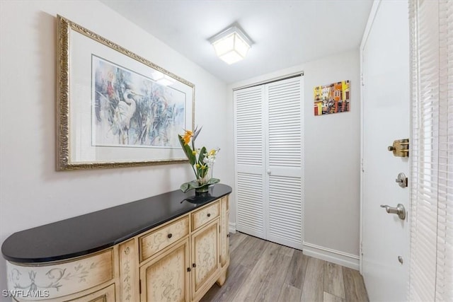 402 Bristle Cone Ln Unit 2, Naples, FL 34113 - hallway featuring light wood-style floors and baseboards