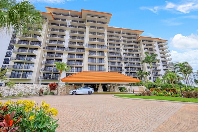 180 Seaview Ct Unit 215, Marco Island, FL 34145 - view of apartment building / complex with uncovered parking