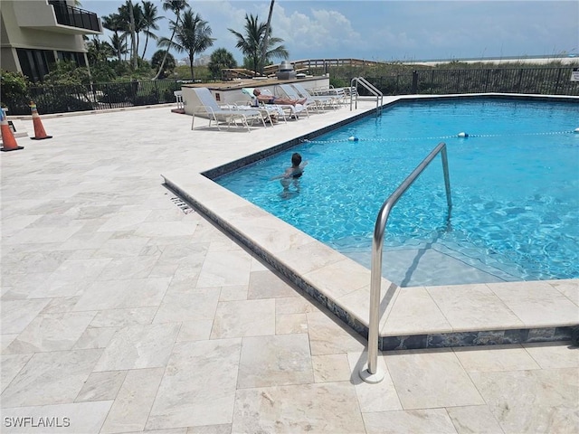 180 Seaview Ct Unit 215, Marco Island, FL 34145 - community pool featuring a patio