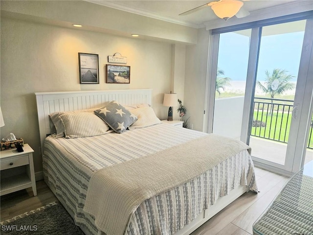 180 Seaview Ct Unit 215, Marco Island, FL 34145 - bedroom featuring access to exterior, crown molding, wood finished floors, and a ceiling fan