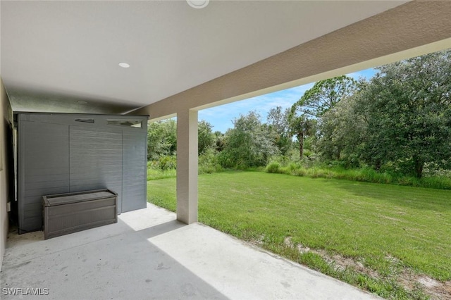 1417 Acacia Ave, Lehigh Acres, FL 33972 - view of patio / terrace featuring view of scattered trees