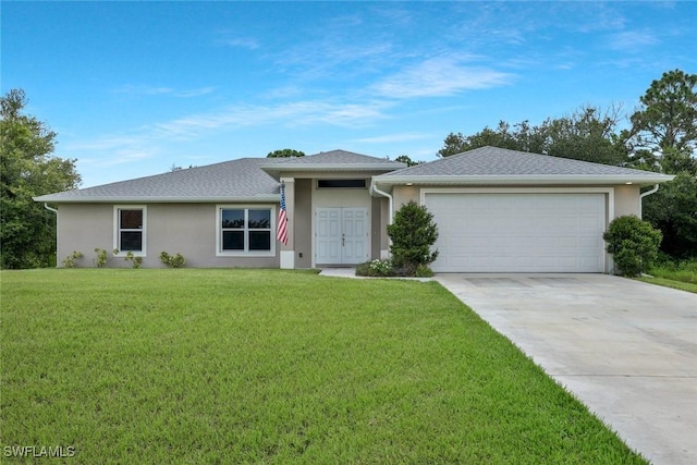1417 Acacia Ave, Lehigh Acres, FL 33972 - view of front of property with stucco siding, concrete driveway, an attached garage, and a front yard