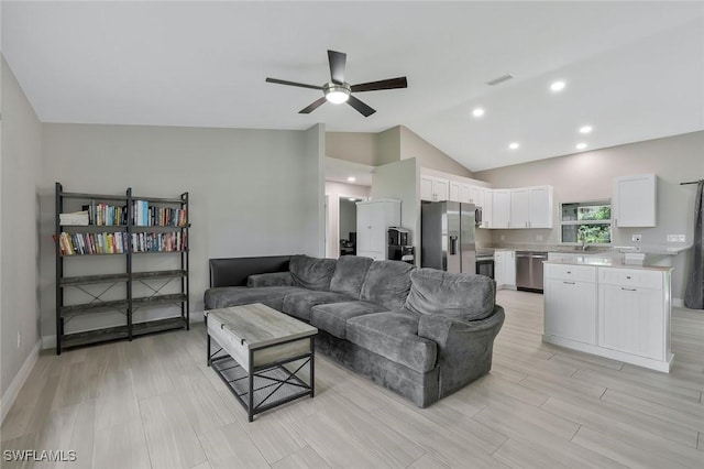 1417 Acacia Ave, Lehigh Acres, FL 33972 - living area featuring lofted ceiling, ceiling fan, and recessed lighting