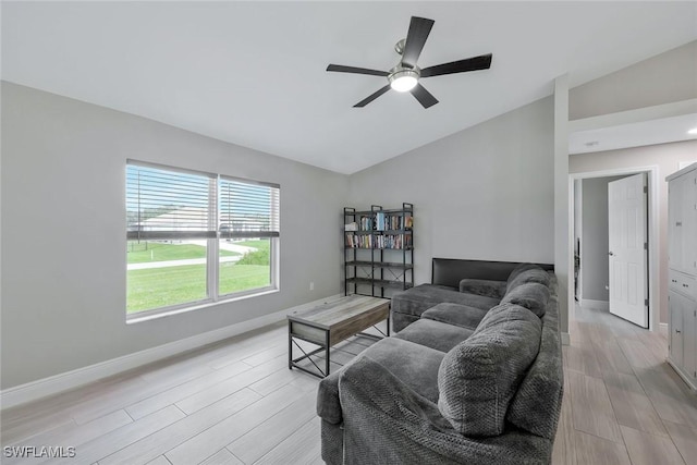 1417 Acacia Ave, Lehigh Acres, FL 33972 - living room with lofted ceiling, light wood finished floors, and ceiling fan