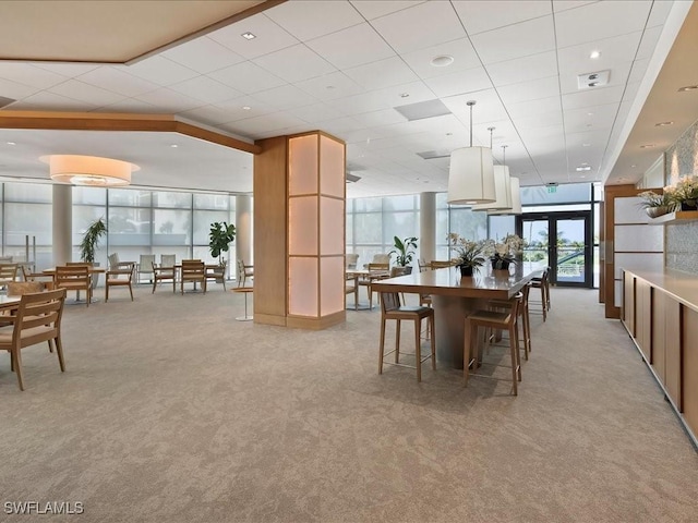 4651 Gulf Shore Blvd N Unit 1605, Naples, FL 34103 - dining space with light colored carpet and a drop ceiling