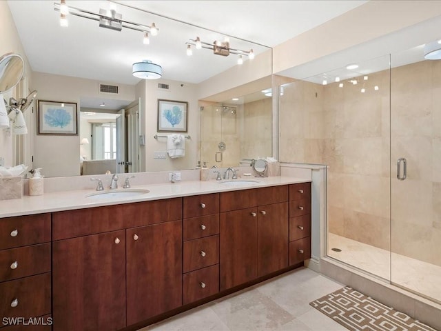 4651 Gulf Shore Blvd N Unit 1605, Naples, FL 34103 - bathroom with a shower stall and double vanity