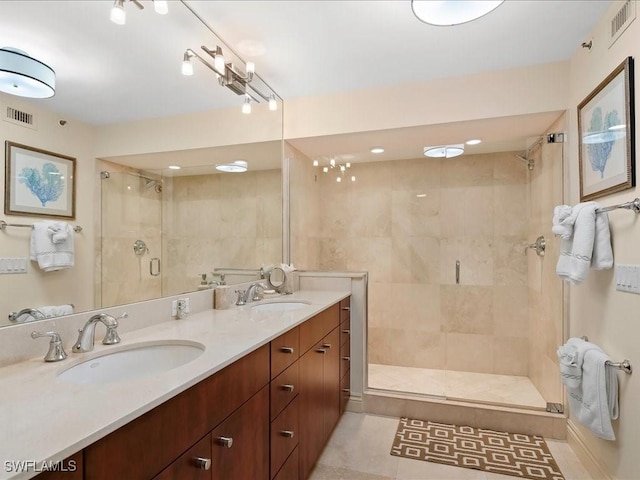 4651 Gulf Shore Blvd N Unit 1605, Naples, FL 34103 - full bath with a stall shower, double vanity, and tile patterned flooring