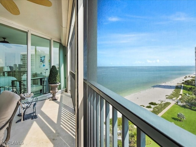 4651 Gulf Shore Blvd N Unit 1605, Naples, FL 34103 - balcony with a ceiling fan and view of water and beach