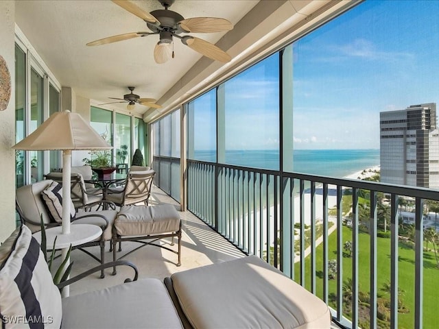 4651 Gulf Shore Blvd N Unit 1605, Naples, FL 34103 - sunroom with a water view and vaulted ceiling