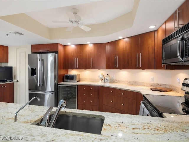 4651 Gulf Shore Blvd N Unit 1605, Naples, FL 34103 - kitchen featuring stainless steel fridge, black microwave, range with electric stovetop, beverage cooler, and a raised ceiling
