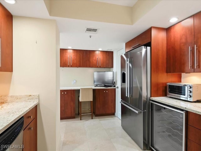 4651 Gulf Shore Blvd N Unit 1605, Naples, FL 34103 - kitchen featuring stainless steel appliances, light stone countertops, and recessed lighting