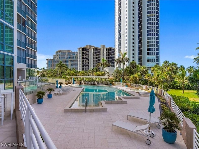 4651 Gulf Shore Blvd N Unit 1605, Naples, FL 34103 - community pool featuring a patio and a view of city