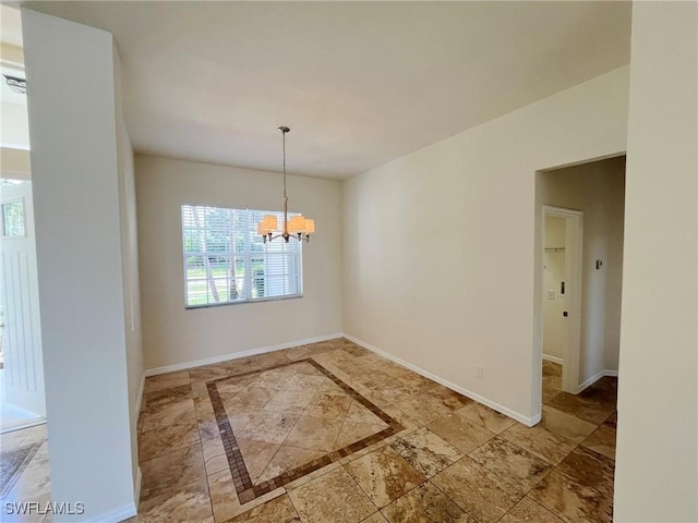 812 Grand Rapids Blvd, Naples, FL 34120 - unfurnished dining area featuring a chandelier and baseboards
