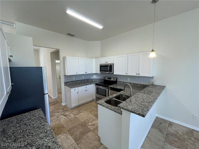 812 Grand Rapids Blvd, Naples, FL 34120 - kitchen featuring stainless steel appliances, dark stone countertops, tasteful backsplash, white cabinets, and a high ceiling