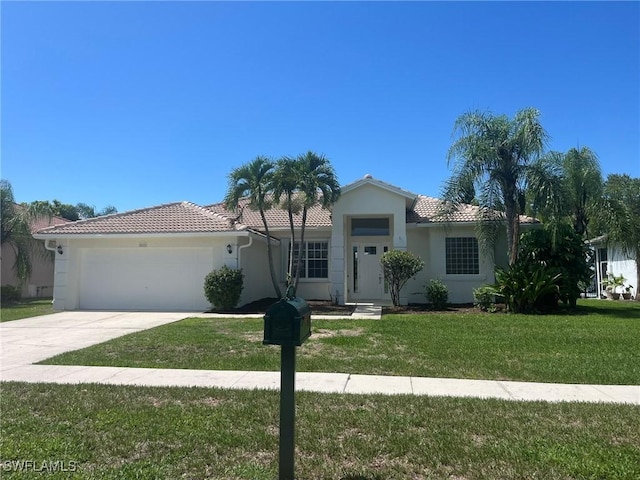 812 Grand Rapids Blvd, Naples, FL 34120 - single story home with a tiled roof, an attached garage, driveway, and a front lawn