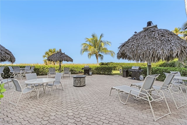180 Seaview Ct Unit 612, Marco Island, FL 34145 - view of patio featuring a grill