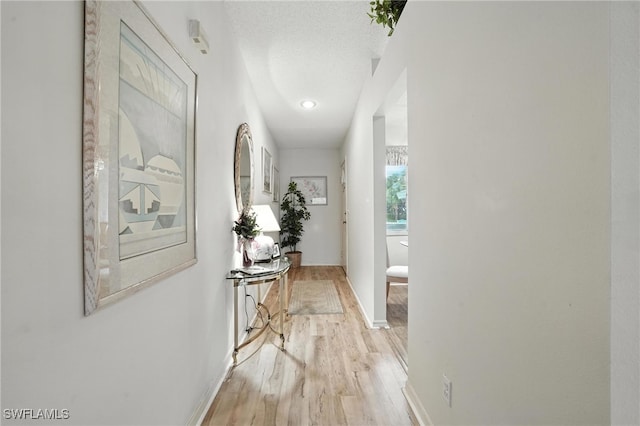 800 New Waterford Dr Unit A202, Naples, FL 34104 - hallway featuring light wood finished floors and baseboards