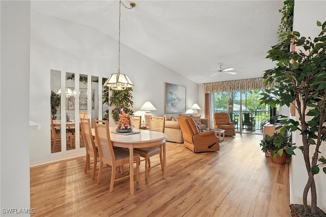 800 New Waterford Dr Unit A202, Naples, FL 34104 - dining area with vaulted ceiling, light wood-type flooring, ceiling fan, and a chandelier